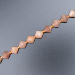 Sunstone bicone faceted sand-colored approx. 8x8mm, 1 strand