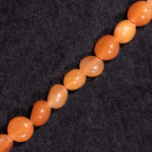 Aventurine nuggets shiny orange ca. 6x8mm, 1 strand